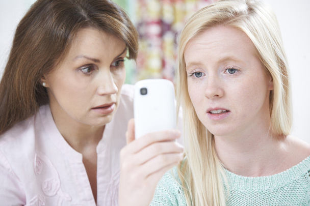 Mother Comforting Daughter Being Bullied By Text Message - Fotografie, Obrázek