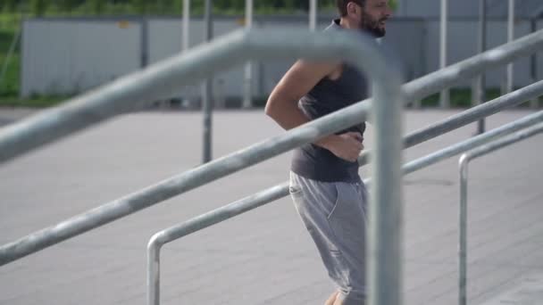 Man jogging up the stairs - Video, Çekim