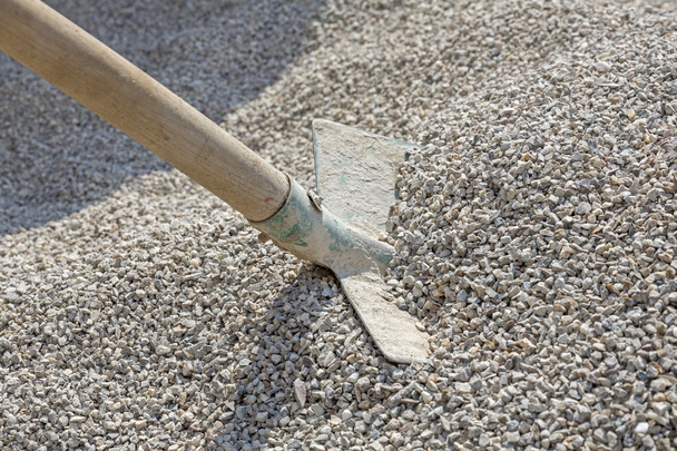 Shovel in a heap of grit - Photo, Image