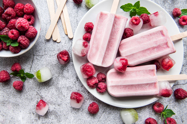 Homemade raspberry ice cream and fresh raspberries. Summer food. - Photo, Image