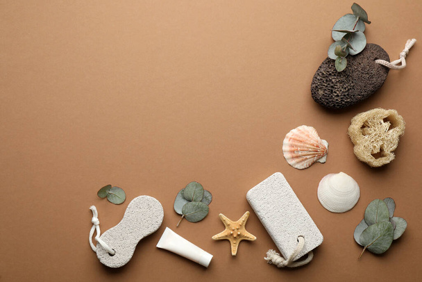 Flat lay composition with pumice stones on brown background. Space for text - Foto, imagen