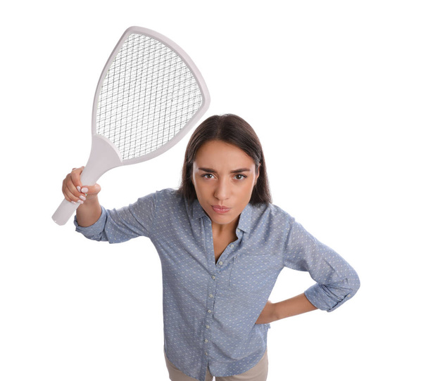 Young woman with electric fly swatter on white background. Insect killer - Foto, Imagen