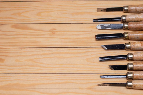 Set of wood cutter tools on wooden plank. - Fotografie, Obrázek