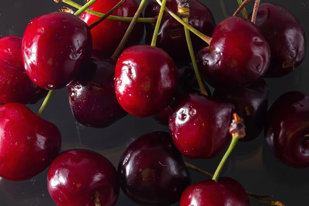 Ripe cherries on a solid background, healthy vegetarian food. Beautiful - Photo, Image