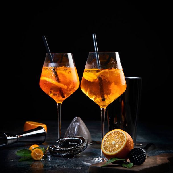 Aperol spritz cocktail served on dark background. Classic drink menu concept. Front view - Photo, image
