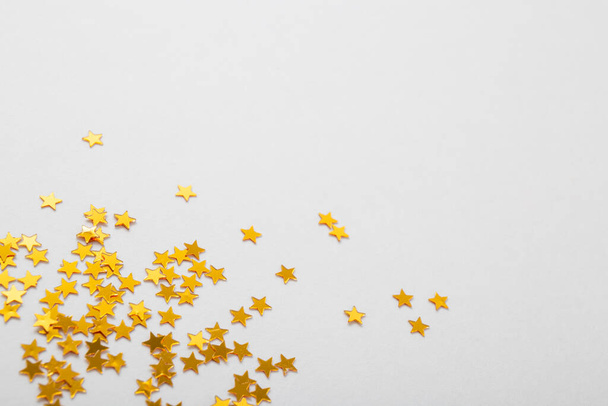 golden stars confetti on white background - Φωτογραφία, εικόνα