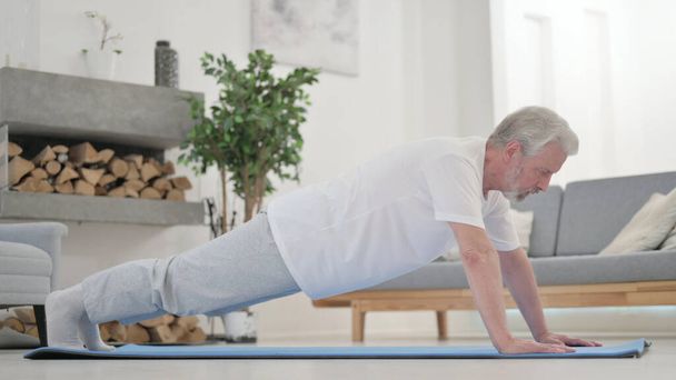 Old Man doing Pushups on Excercise Mat - Photo, Image