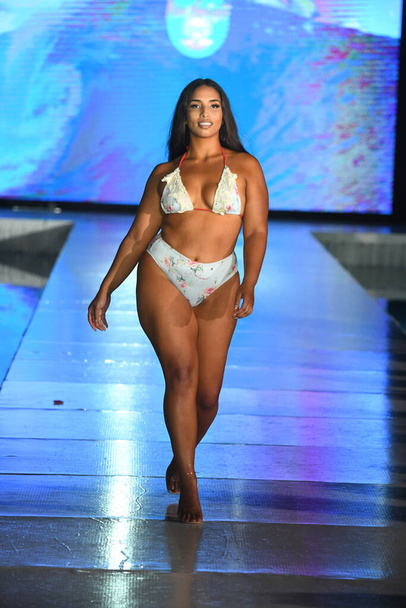 MIAMI BEACH, FLORIDA - JULY 10: A model walks the runway for Mar Ardiente Swim Show during Miami Swim Week The Shows powered by DCSW on July 10, 2021 in Miami Beach, Florida - Fotoğraf, Görsel
