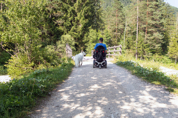 Disabled man with his dog - Zdjęcie, obraz