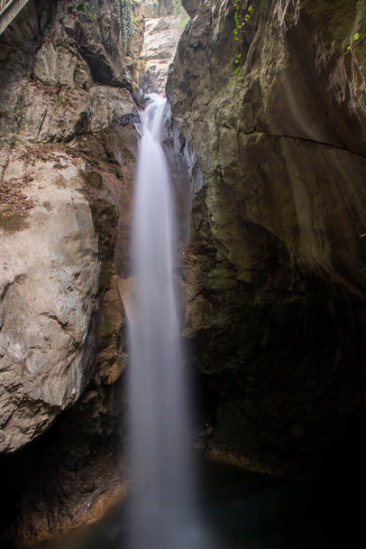 General front view of Samandere Waterfall plashing from high rocks surrounded by forest. Duzce, Turkey - Photo, Image