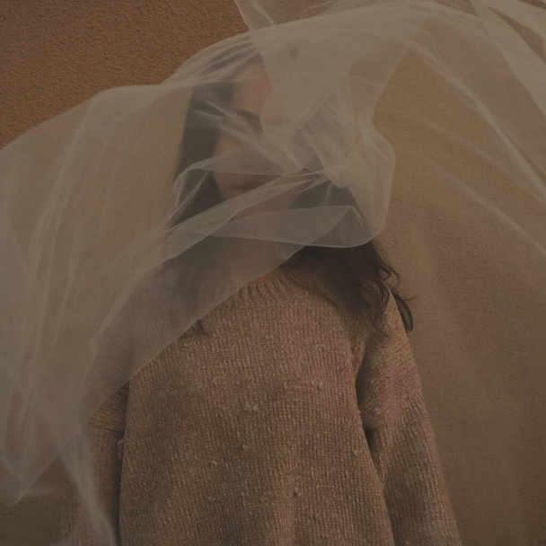 bride in a veil with a wedding dress - Fotó, kép