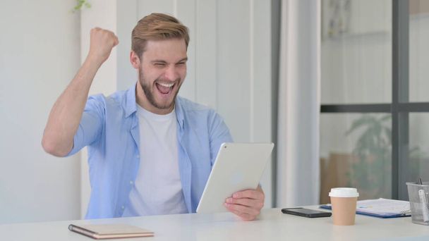 Successful Young Man Celebrating on Tablet  - Photo, Image