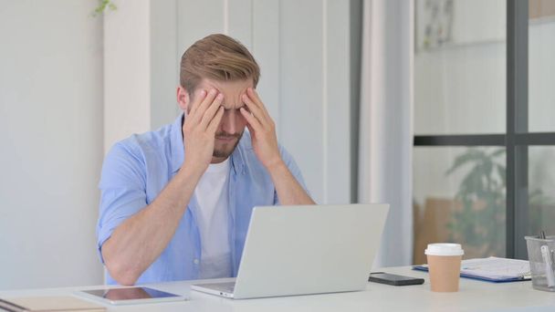 Young Man having Headache at Work - Photo, Image