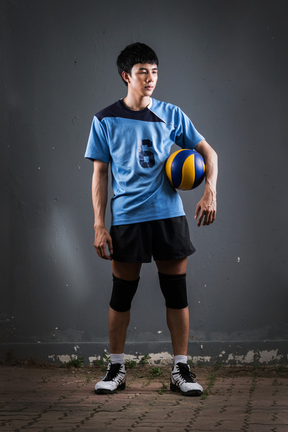 Asiatische Volleyballerin in Aktion - Foto, Bild