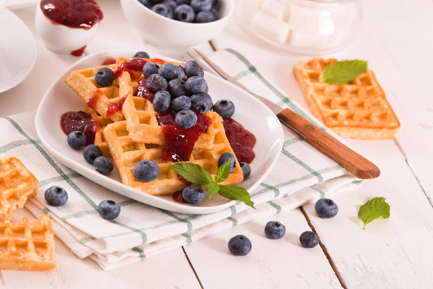 Waffles with blueberries and jam.  - Photo, Image