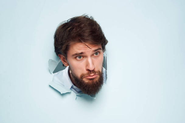 bearded man breaks through the wall  background - Photo, Image
