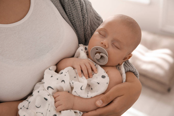 Mother holding her sleeping baby indoors, closeup - Fotoğraf, Görsel