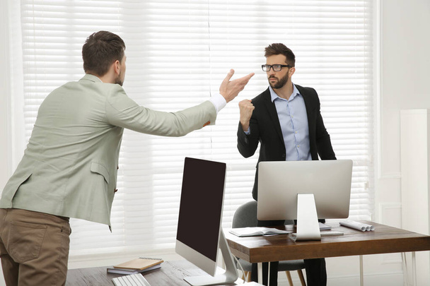 Emotional colleagues arguing in office. Toxic work environment - Photo, image