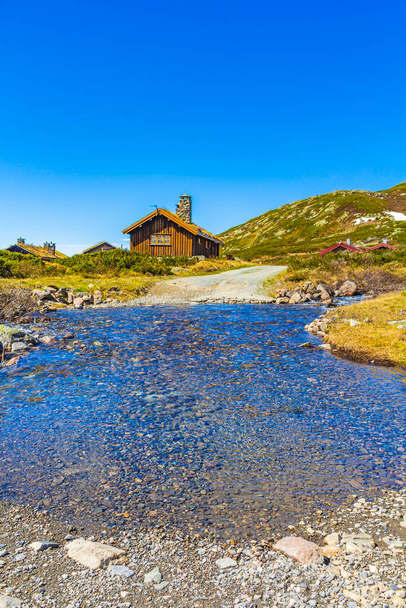 River and cottages huts at Vavatn landscape panorama view in the mountains of Hemsedal Norway. - Φωτογραφία, εικόνα