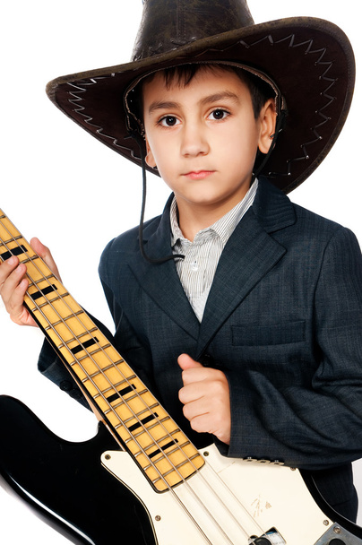 Boy in a cowboy hat and guitar - Zdjęcie, obraz