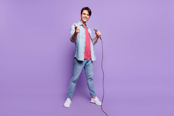 Full body photo of young man happy positive smile point finger you choice star stage singer isolated over purple color background - Фото, изображение