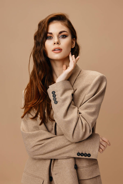 pretty woman model in coat posing. High quality photo - Foto, immagini