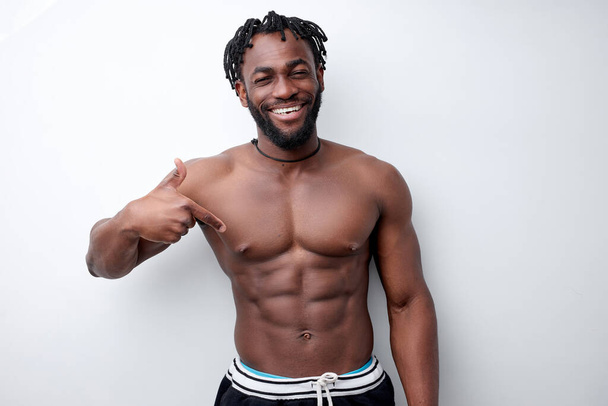 Fit young afro american man with beautiful torso, isolated on white background - Photo, image