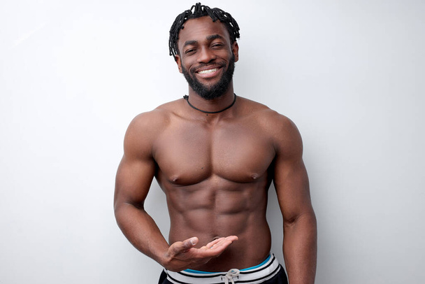 Athlete young afro american man with beautiful torso, isolated on white background - Valokuva, kuva