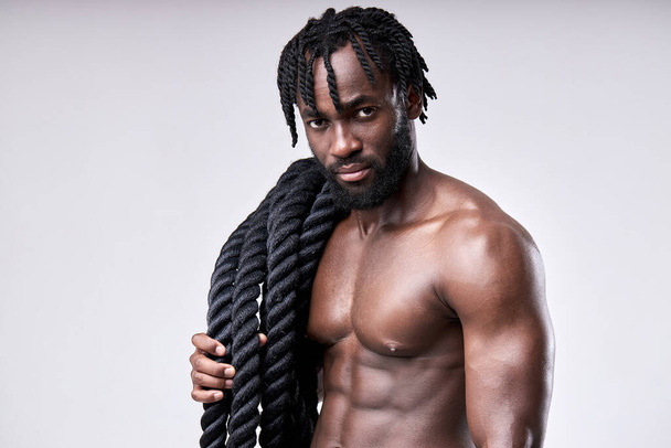 Handsome sporty african guy bare-chested muscular sportsman isolated on white background - Valokuva, kuva