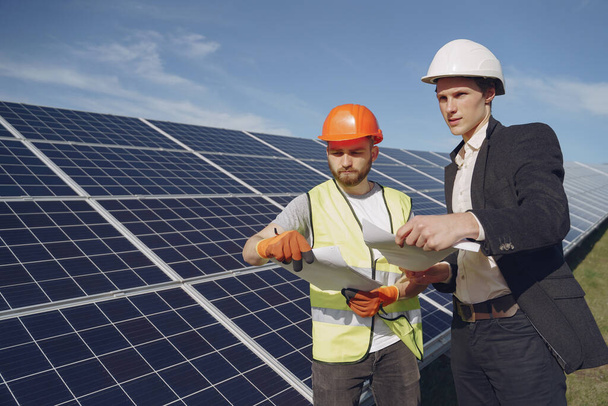 Foreman and businessman at solar energy station. - Photo, Image
