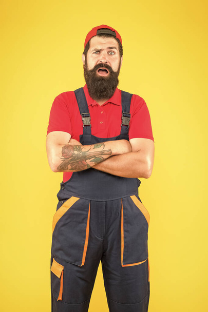bearded male handyman. amazed mature man worker with beard. electrician repair and fix. professional delivery loader service. confident in uniform. working on construction site. Fatherhood concept - Photo, Image