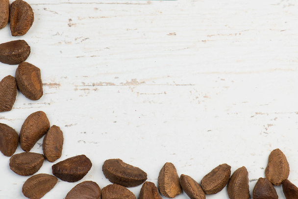 Pecan nuts on a textured shabby white background, healthy vegan food - Foto, Imagem