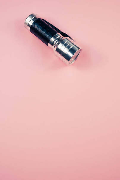 A closeup sholed fleshlight isolated on pink background - Foto, afbeelding