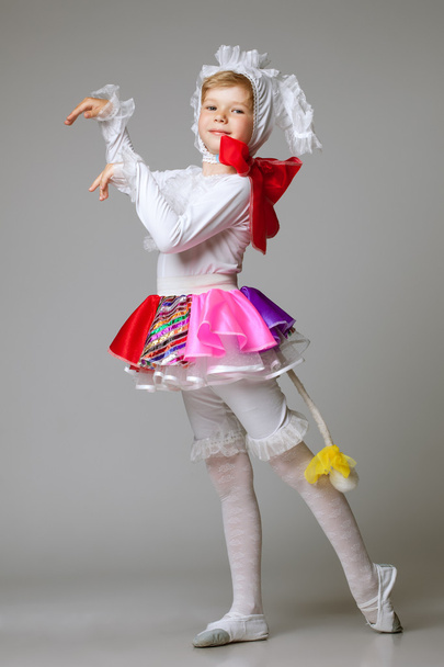 Lovely little girl dancing in colorful costume - Foto, afbeelding