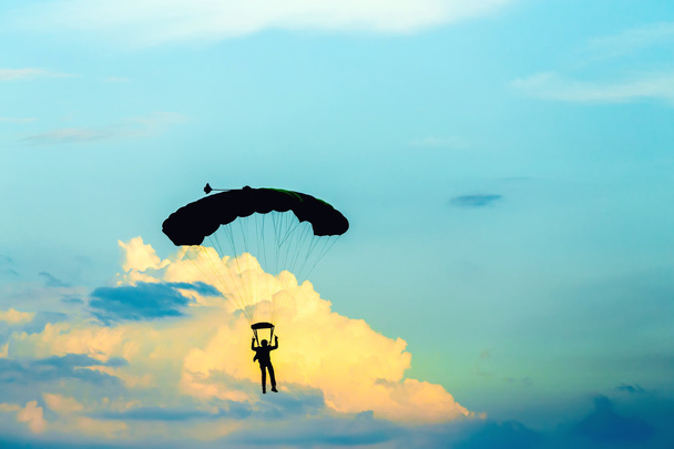 unidentified skydiver, parachutist on blue sky - Photo, Image