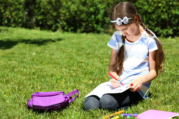 girl drawing in park - Photo, image