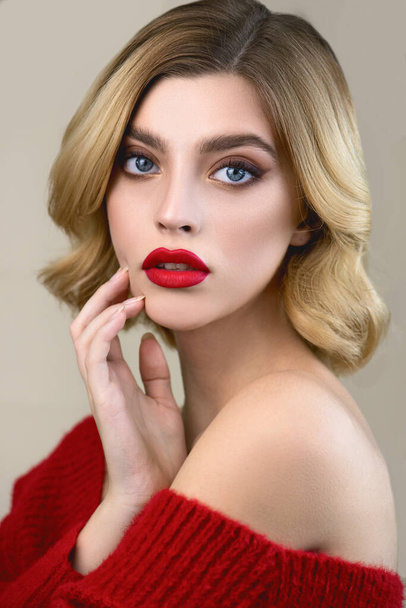 Beautiful young woman  with perfect young skin and professional makeup with red lips.  Skincare seasonal beauty concept. Close up. - Foto, afbeelding