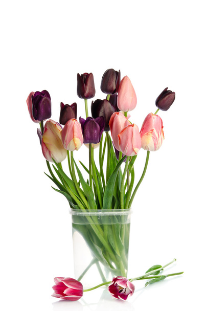 Beautiful bouquet of tulips in transparent vase isolated on whit - Fotó, kép