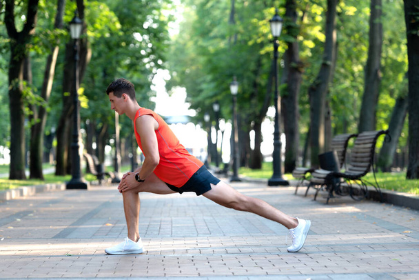 Get warmed up before workout. Man take warmup. Sportsman hold lunge position. Warmup exercises - Photo, Image
