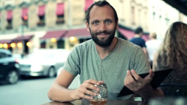 Man with tablet computer in cafe - Felvétel, videó