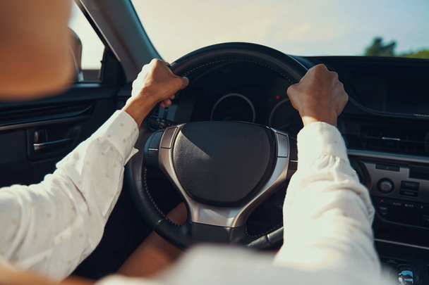 Hand on steering wheel of expensive car - 写真・画像