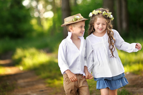Portrait of a boy and girl in summer - Photo, Image