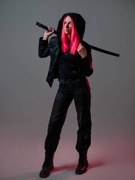 Techno cyber punk style, futuristic ninja fighter, young woman with pink hair - Photo, Image