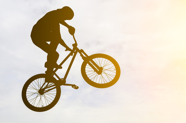 Man doing an jump with a bmx bike. - Foto, Bild