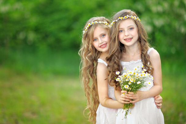 Portrait of two girls in the woods girlfriends - Fotografie, Obrázek