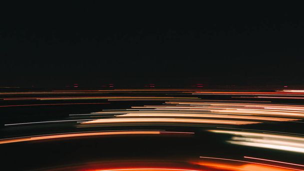 Night road lights. Lights of moving cars at night. long exposure multicolored - 写真・画像
