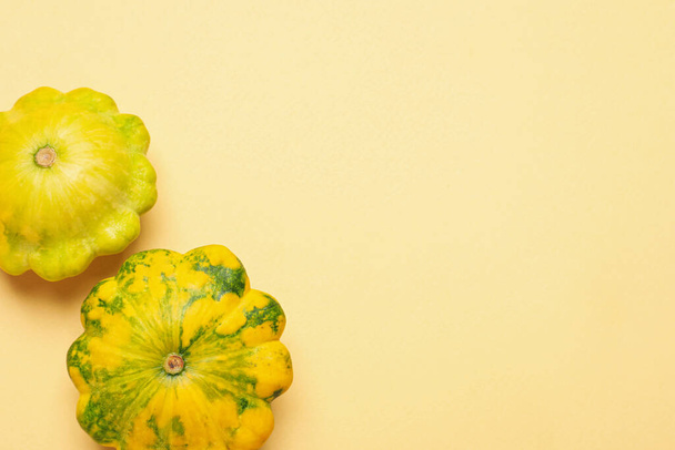 Fresh ripe pattypan squashes on beige background, flat lay. Space for text - Фото, зображення