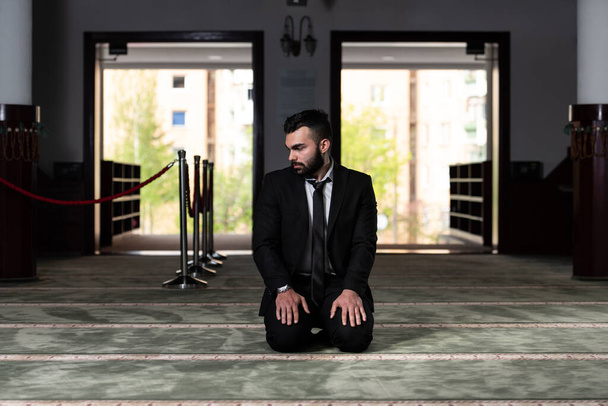 Businessman Muslim Making Traditional Prayer to God Allah in the Mosque - Valokuva, kuva