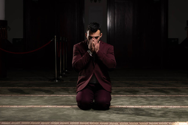 Businessman Muslim Making Traditional Prayer to God Allah in the Mosque - Fotó, kép