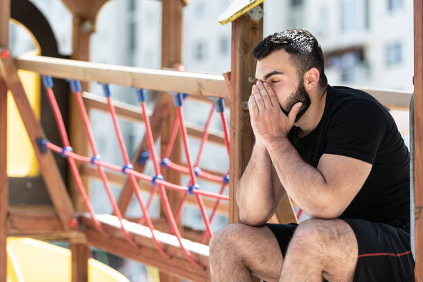 Young Fit Handsome Adult Man Resting Outdoors on Playground Park - Φωτογραφία, εικόνα